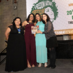 Advancement Project National Office staff members Maria Fernandez (second left) and Losmin Jimenez (far right) present the Just Democracy Award to Puente Human Rights Movement.