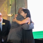 A warm embrace between Norris Henderson from Voice of the Experienced (VOTE) and Jennifer Lai-Peterson.